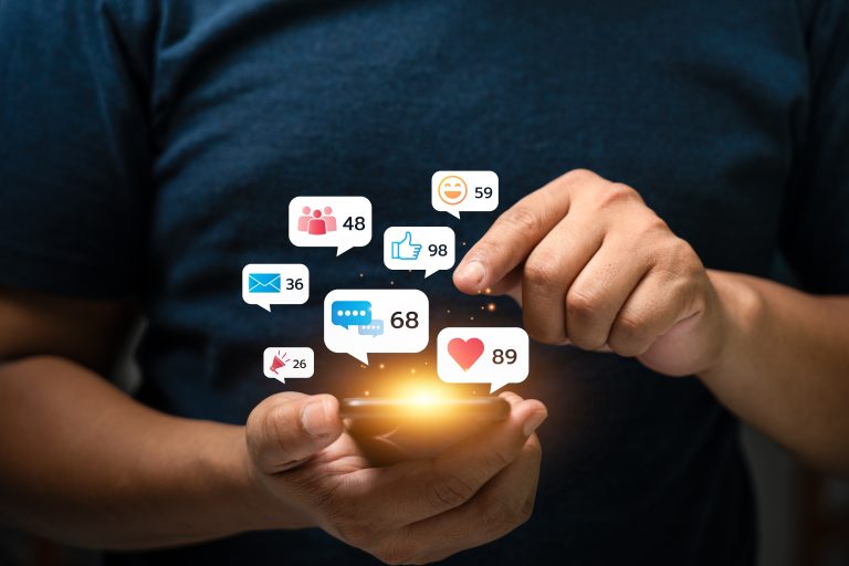 Young,Man,Using,Smartphone,With,Multiple,Social,Media,Notifications,Displayed Young,Man,Using,Smartphone,With,Multiple,Social,Media,Notifications,Displayed